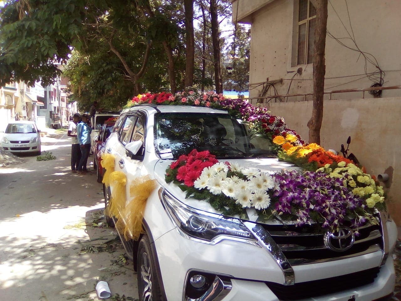 Grand wedding ceremonial bridal car floral canopy and procession styling